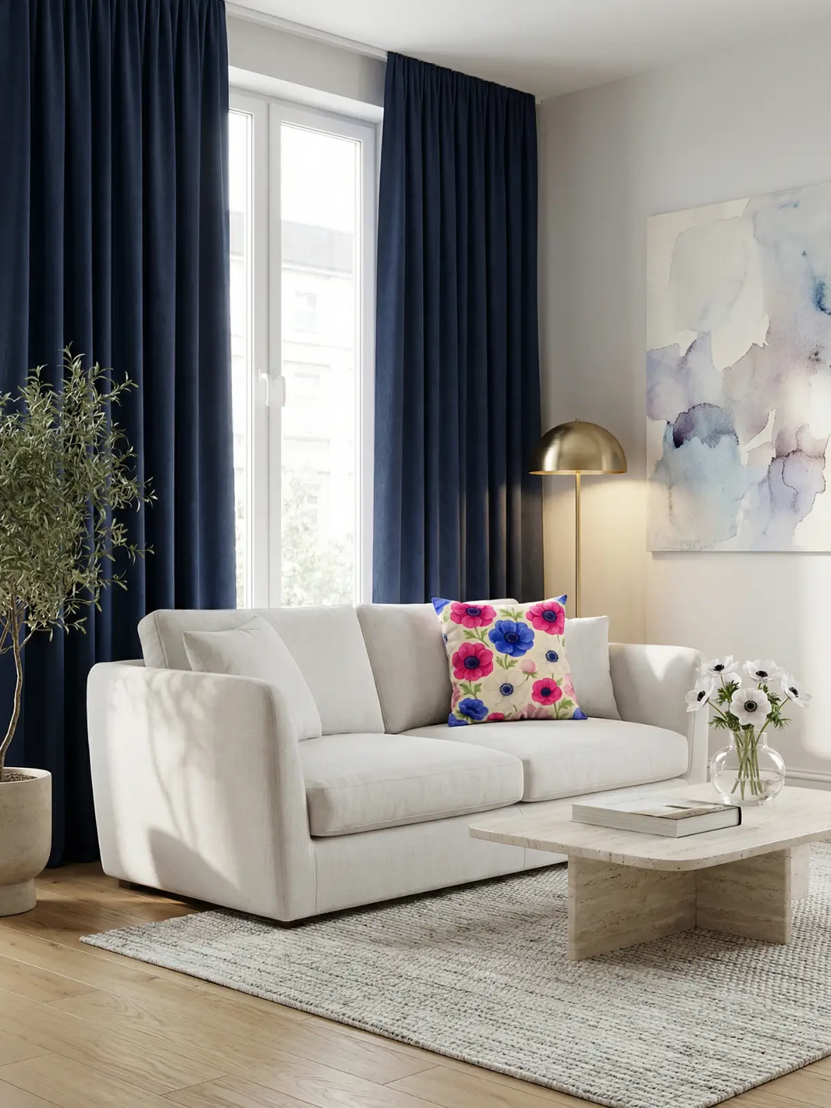 Luxury contemporary living room with navy blue curtains and Anemone Watercolor Pillow on a white linen sofa