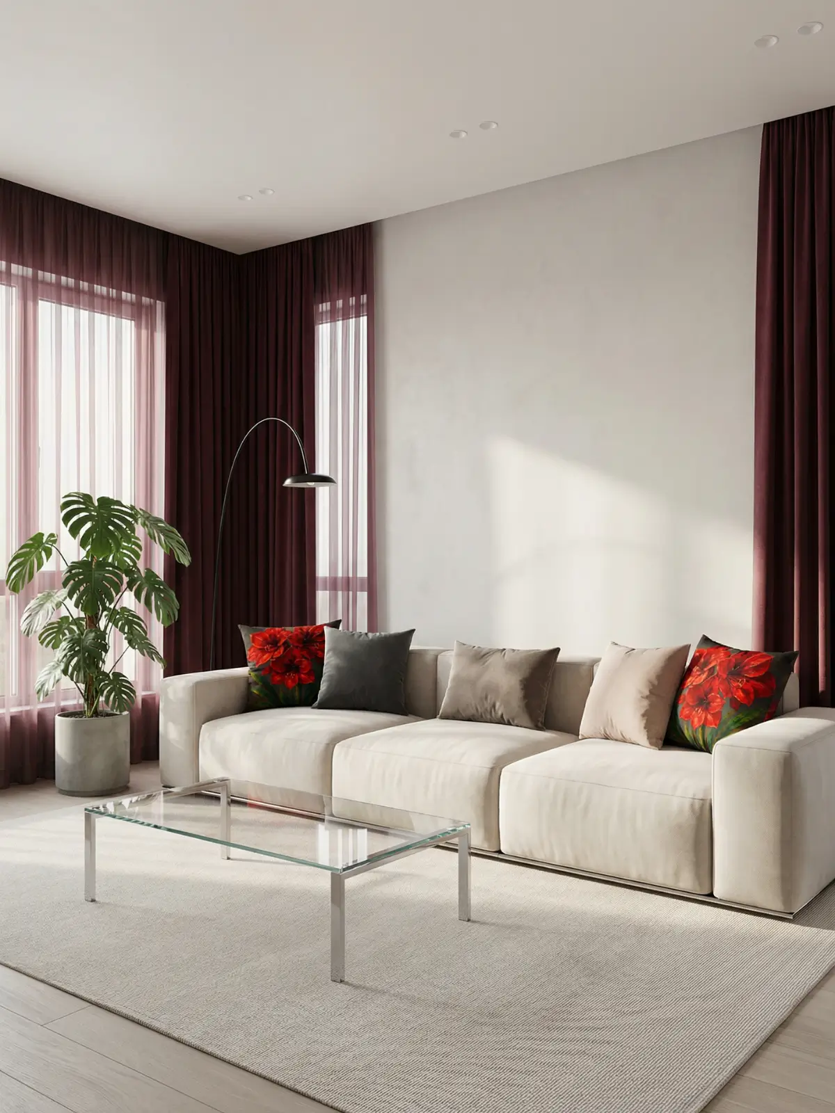 Modern luxury living room with burgundy curtains, cream modular sofa, glass coffee table, and red amaryllis floral pillows