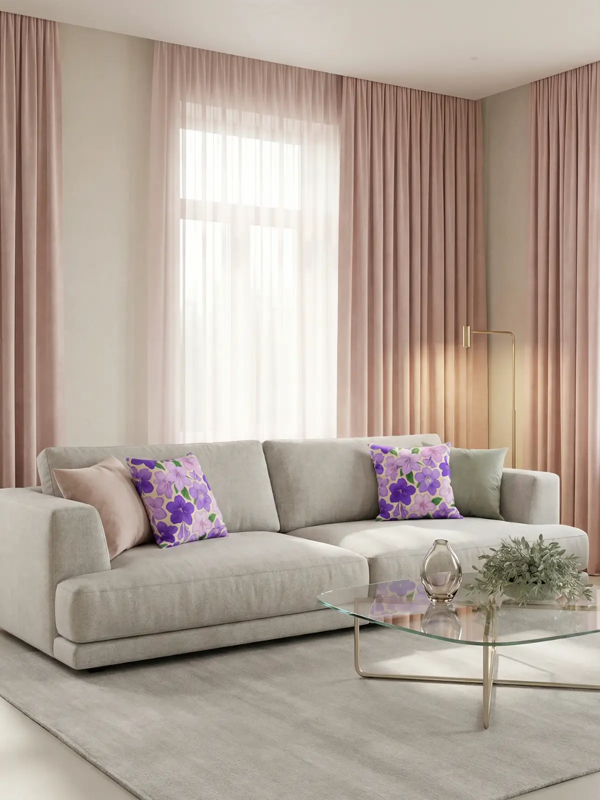 Luxury living room with blush pink curtains, light gray sofa, glass coffee table, and streptocarpus floral pillows