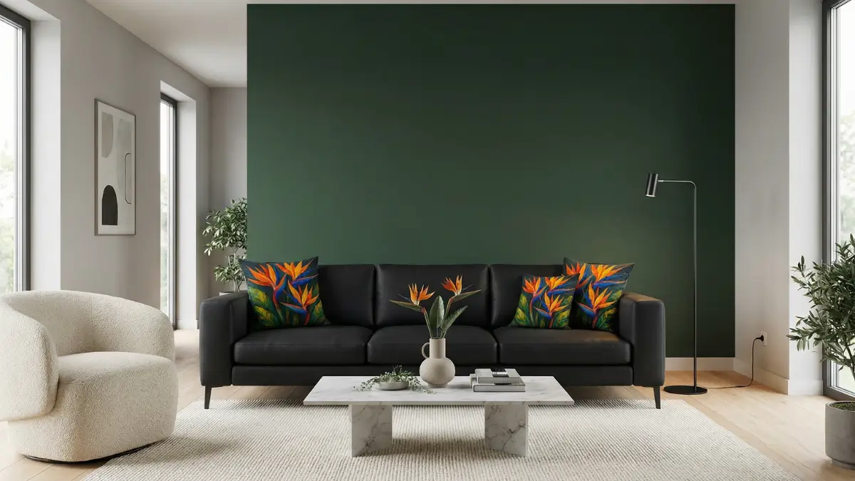 Ultra-realistic Luxury Modern Minimalist Living Room featuring a Matte Black 3-Seater Sofa styled with three Bird of Paradise Impasto Throw Pillows (Orange, Tropical Green), set against a deep forest green accent wall and light oak flooring, under soft natural daylight.