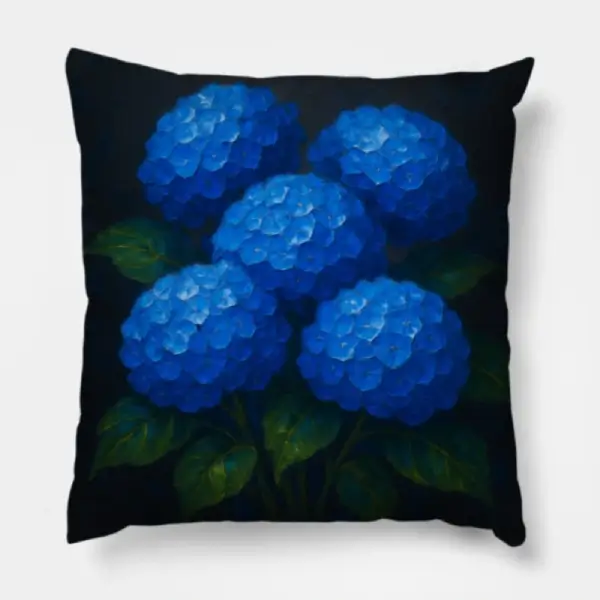 Two identical blue hydrangea impasto charcoal pillows placed at each end of a charcoal modern sofa
