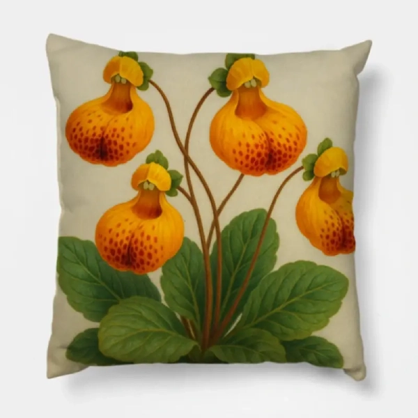 Two calceolaria uniflora watercolor pillows on a camel leather 3-seat sofa